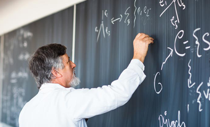 teacher-writing-on-blackboard